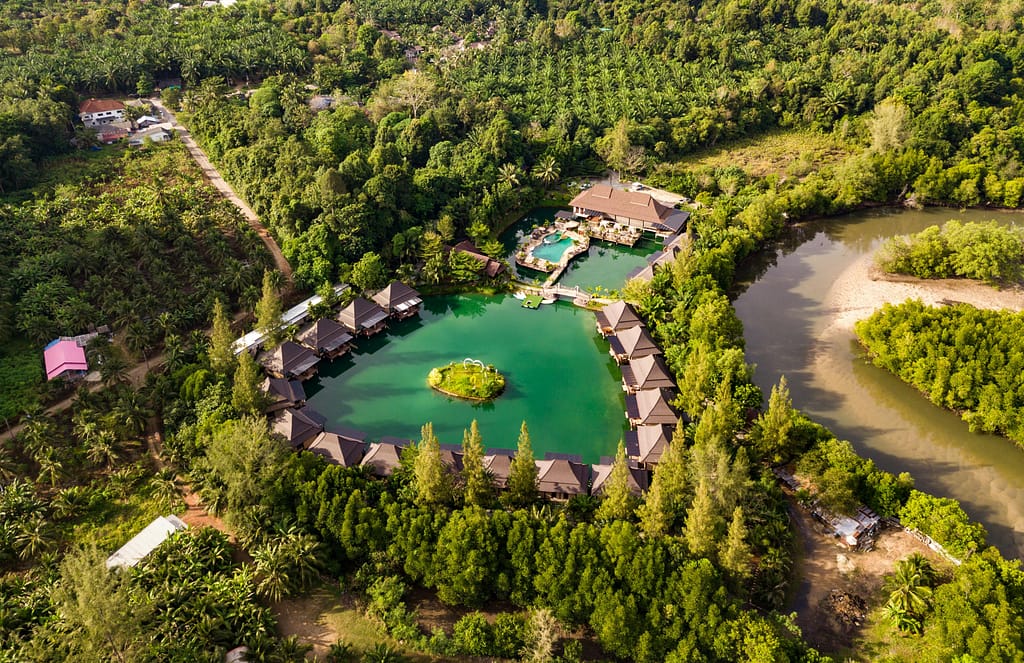 Aerial view of a stunning resort surrounded by lush greenery in Ao Nang, Krabi, Thailand.